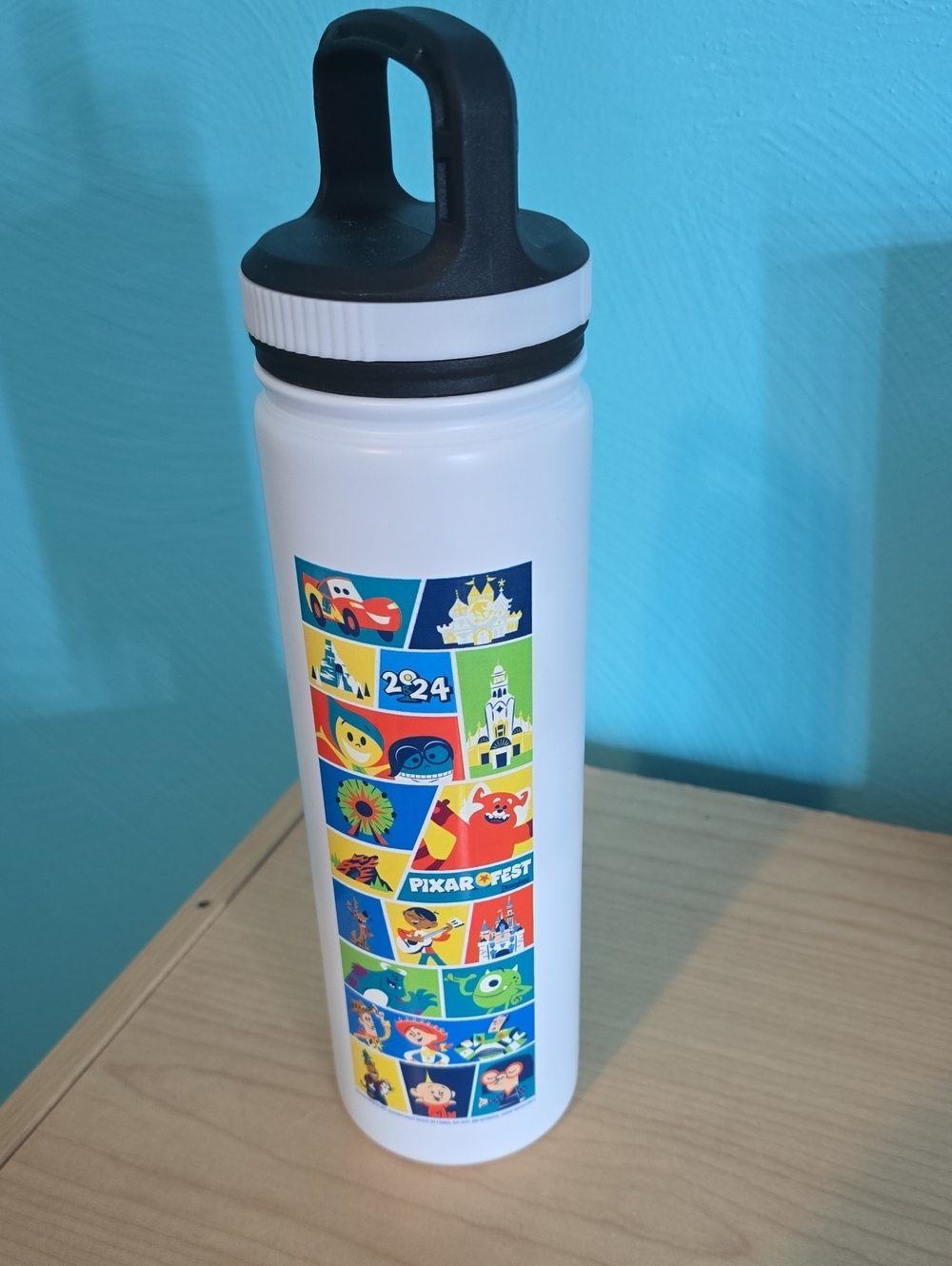 Disney White Water Bottle with Black Lid and Colorful Pixar Panels